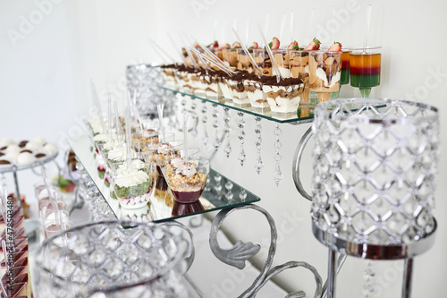 Wedding candy bar with desserts on the table. Buffet with delicious bakery