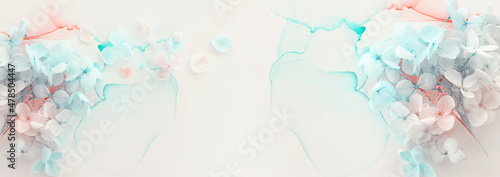 Fotografia Creative image of pastel blue and pink Hydrangea flowers on artistic ink background