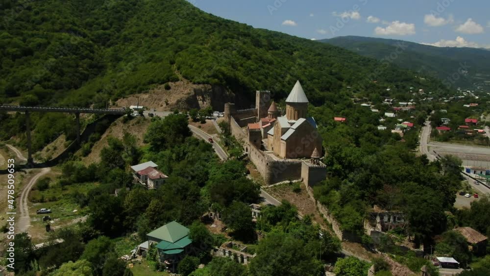 Aerial view of Church Tower At Ananuri Fortress Complex Overlooking Zhinvali Reservoir In Georgia. Travel to Sakartvelo Aerial view of Church Tower At Ananuri Fortress Complex Overlooking Zhinvali Reservoir In Georgia. Travel to Sakartvelo