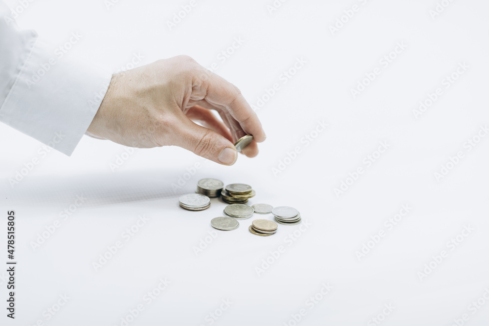 hand counts and stacks coins