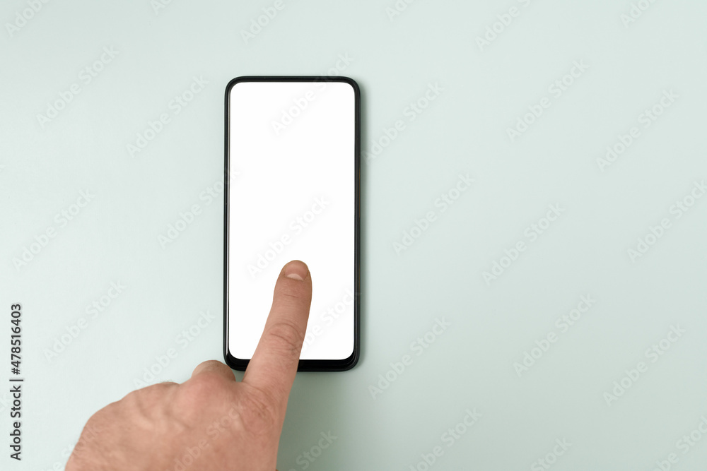 A smartphone with an empty white display, a finger touching the screen. Blue-green pastel background.