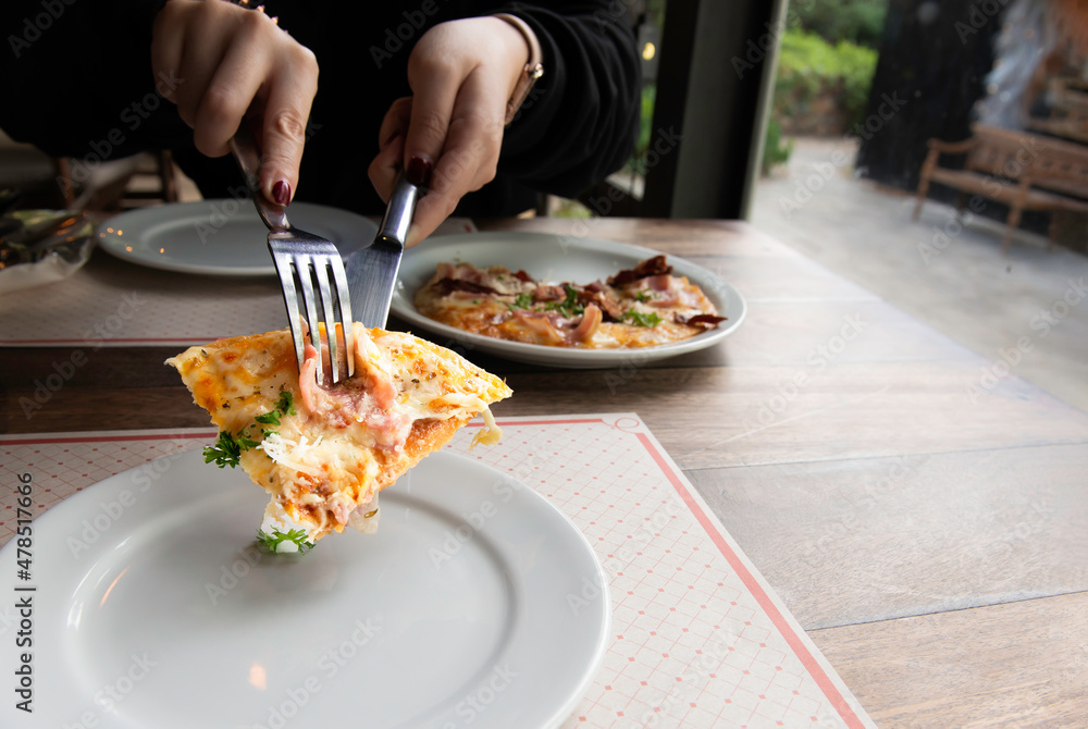 Ham, Bacon, Thin Crust Pizza.Delicious pizza with salami, sausages, mozzarella and tomato sauce ready for served. Ham, Bacon, Thin Crust Pizza.Delicious pizza with salami, sausages, mozzarella and tomato sauce ready for served.