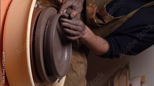 master's transformation of clay into ceramic design with artistic touches
