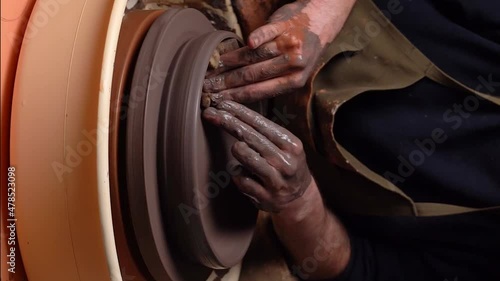 master's transformation of clay into ceramic design with artistic touches