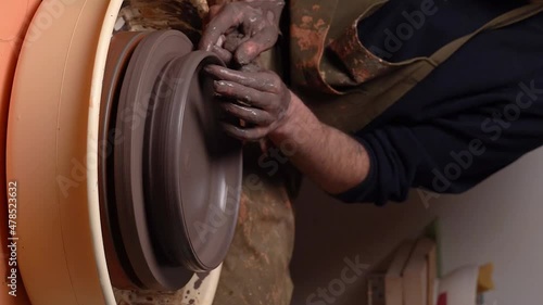 master's transformation of clay into ceramic design with artistic touches
