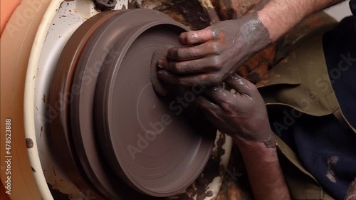 master's transformation of clay into ceramic design with artistic touches