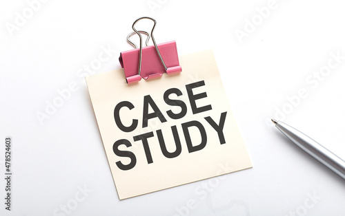 CASE STUDY text on sticker with pen on the white background