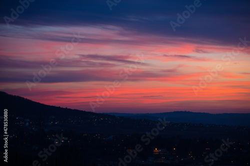 Landscape with colorful sky and streetlights. © astrosystem