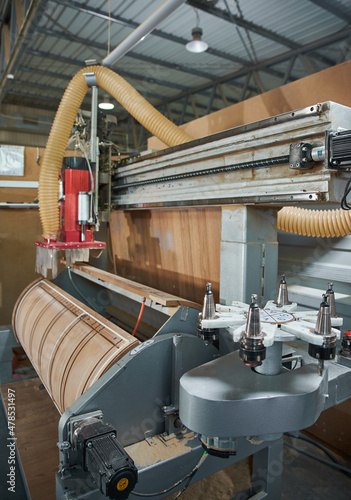 The process of making doors, laminating chipboard at the factory