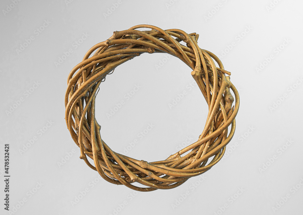 Christmas wreath. Decorative element. made of twigs with gilding. Close-up, texture. On a white background Christmas wreath. Decorative element. made of twigs with gilding. Close-up, texture. On a white background
