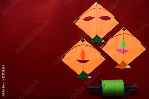 Kites and spool on red background. Makar sankranti Indian festival posters for Uttarayan, Lohri and Pongal. Kite festival. Patang aur Manjha photo