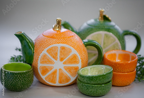 Ceramic teapot handmade orange with a gold leaf