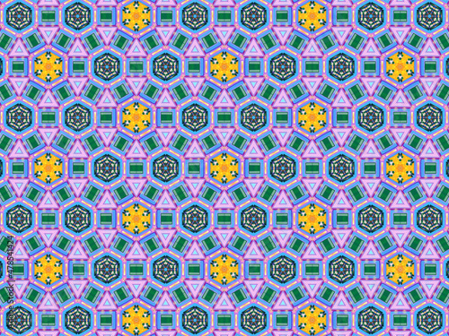 A sophisticated geometric pattern inspired by Middle Eastern and Moroccan ornaments. Elaborate kaleidoscopic surface print in blue, purple and yellow colors for textile design and gift wrapping paper.