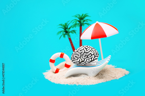 Human brain having a sandy beach vacation
