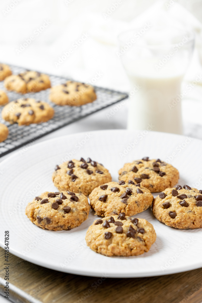 Delicious Whole Wheat Chocolate Chip Cookies set on white cafe table. Delicious Whole Wheat Chocolate Chip Cookies set on white cafe table.