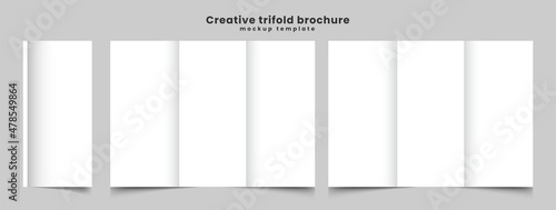 A4 Tri-Fold Brochure Mock-Up. Blank trifold paper brochure on gray background with soft shadows and highlights