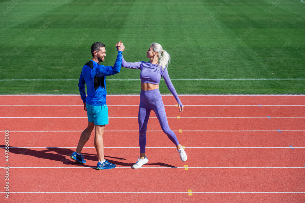 sport couple celebrate team win. fitness partners. athletic man and ...