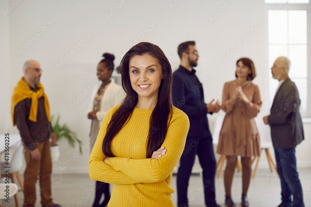 Portrait of successful young businesswoman pose in office show leadership and confidence. Profile picture of smiling woman employee or worker forefront at workplace. Business leader or ceo. - obrazy, fototapety, plakaty 