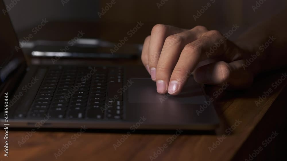 The Male Fingers Touch The Touchpad Of The Laptop. Working on a Laptop Using Touchpad Technology. Close-up of the Touchpad, the Laptop, and the Male Hands. 4K The Male Fingers Touch The Touchpad Of The Laptop. Working on a Laptop Using Touchpad Technology. Close-up of the Touchpad, the Laptop, and the Male Hands. 4K