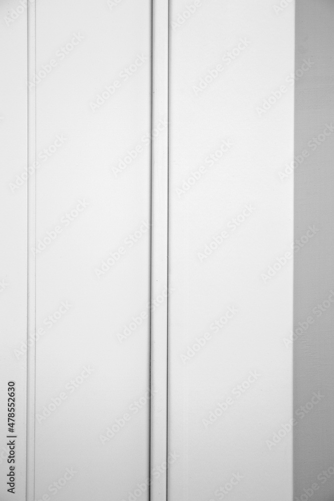 The lines draw the boundary between a white door and the white wall. The lines draw the boundary between a white door and the white wall.