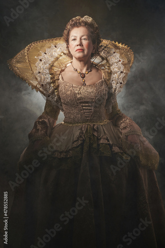 The image of Queen Elizabeth I of the 16th century. Historical reconstruction. The image of the queen in smoke on a gray background. High quality photo