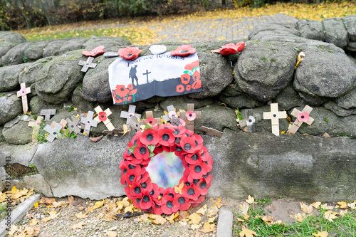 Lest we forget - Remembrance poppies and wreath symbol of the first World War WOI at old trenches near Ypres Belgium photo