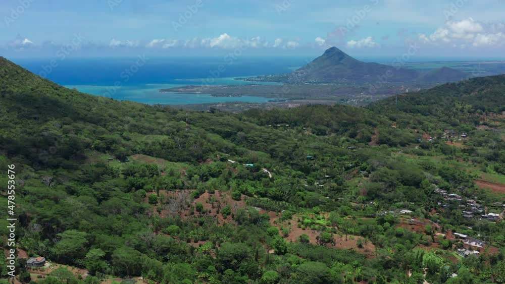 View from the height of the snow-white beach of Le Morne on the island of Mauritius in the Indian Ocean. Green jungle. View from the height of the snow-white beach of Le Morne on the island of Mauritius in the Indian Ocean. Green jungle.