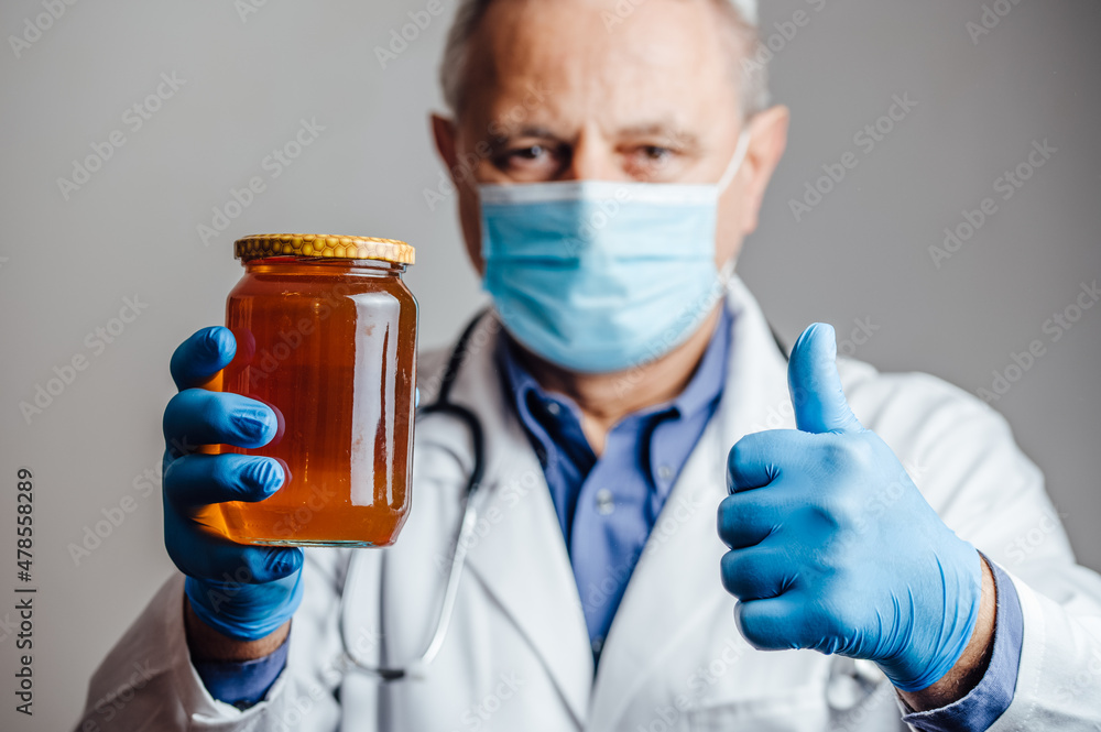 Nutritionist recommending organic honey to his patients Nutritionist recommending organic honey to his patients