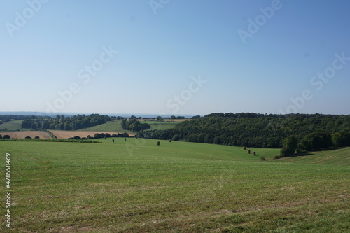 view over rolling farm fields. English countryside view on clear day over agricultural farmland. 