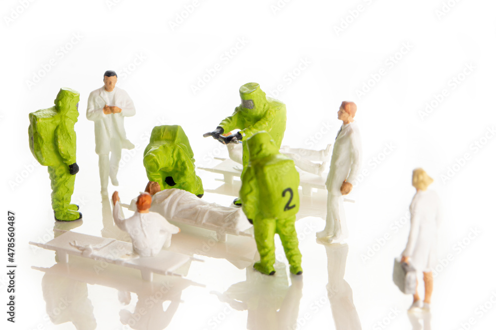 Obraz na plátně the team of miniature figurines of special doctor forces and normal doctors havi