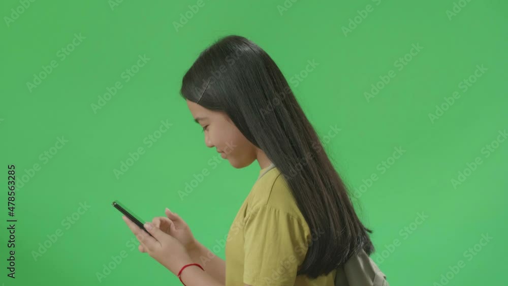 Side View Of Asian Girl Student Use Mobile Phone And Walking To School On Green Screen Chroma Key
Side View Of Asian Girl Student Use Mobile Phone And Walking To School On Green Screen Chroma Key