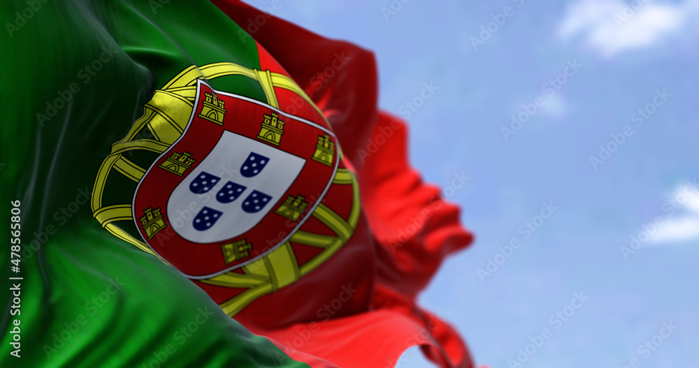 Detail of the national flag of Portugal waving in the wind on a clear day Detail of the national flag of Portugal waving in the wind on a clear day