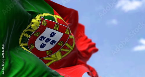 Detail of the national flag of Portugal waving in the wind on a clear day