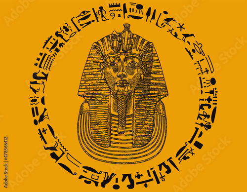 Brwon Ancient Tutankamon Pharao mask with hieroglyphics and yellow background.  photo