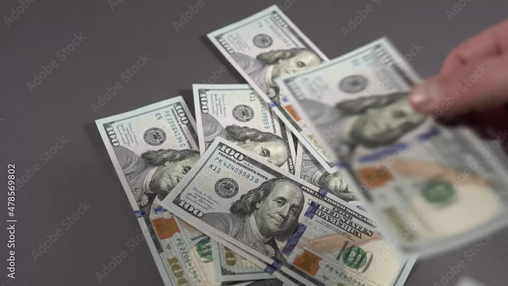 money dollars in hands on a black background money dollars in hands on a black background