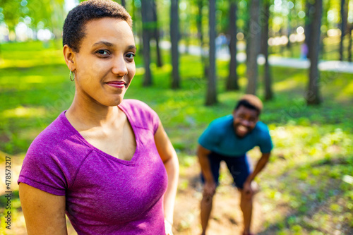 Fit young tired african american couple in sport activity outdoors runs in morning