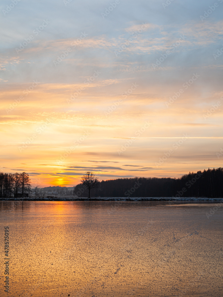 Naklejka premium sunset over the river