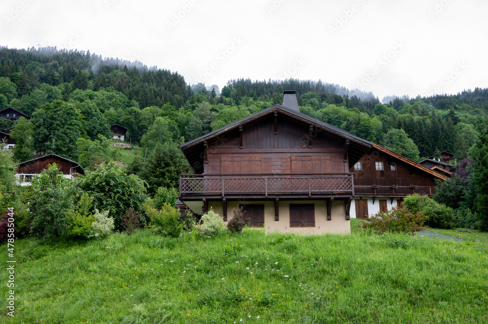 Panoramic view on mountain villages, green forests and apline meadows near Saint-Gervais-les-Bains, Savoy. France