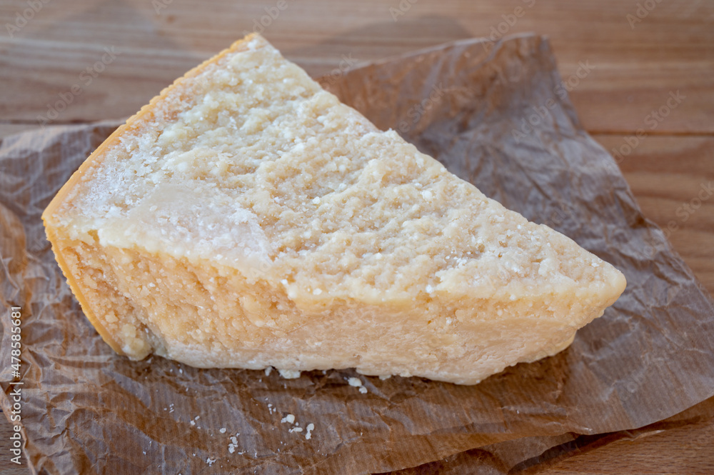 Cheese collection, piece of matured cow cheese pasmesan parmigiano reggiano made from cow milk