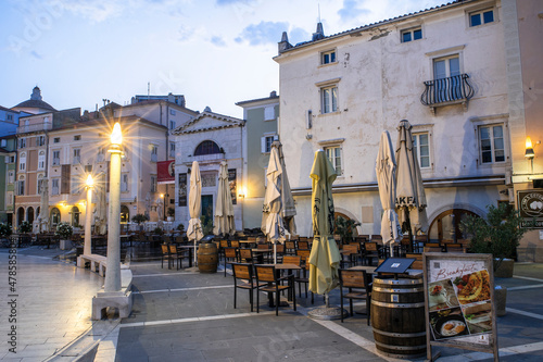 PIRAN,SLOVENIA - July 31, 2021: Reastaurants and Beer Gardens at historical Tartini Square in Piran , Slovenia closed at early morning hours.