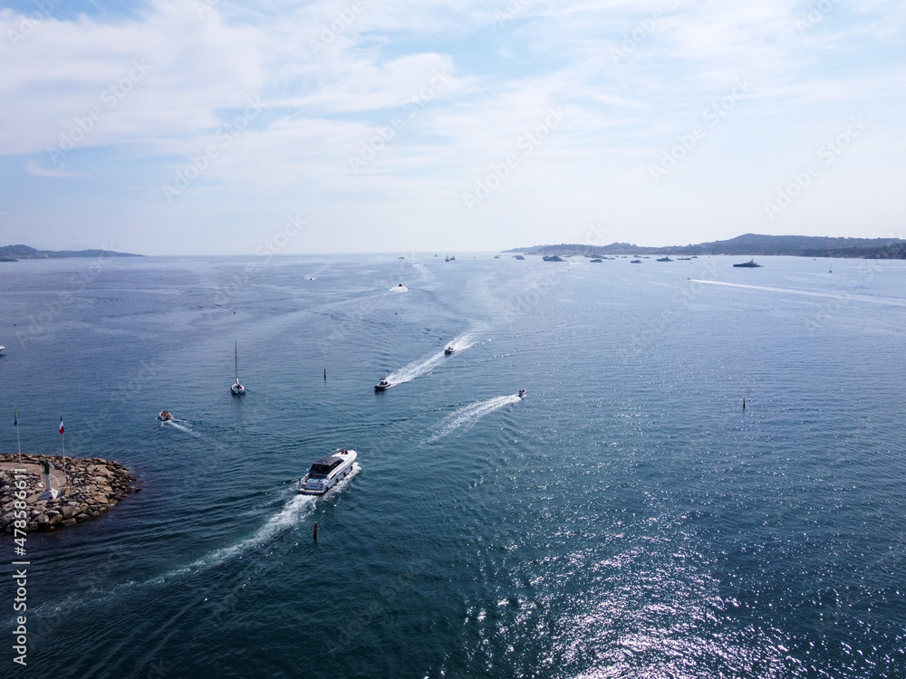Obraz premium Aerial view on blue water of Gulf of Saint-Tropez and sailboats near Port Grimaud and port Cogolin, French Riviera, Provence, France