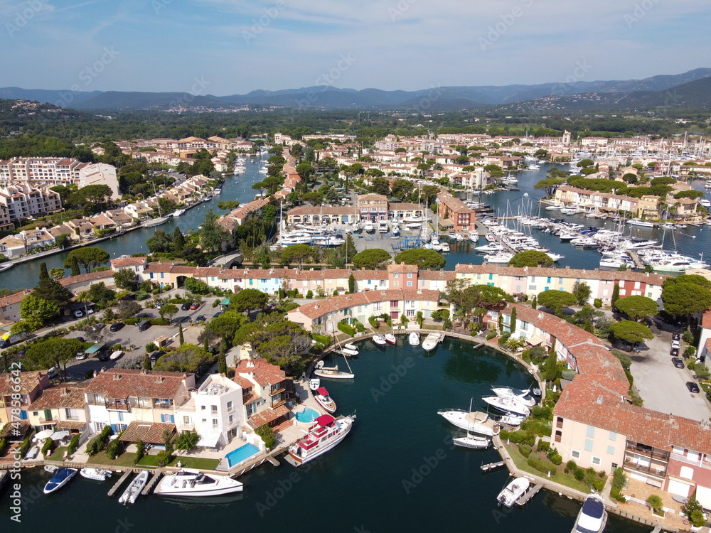 Aerial view on small houses and sailboats of Port Grimaud and port Cogolin, French Riviera, Provence, France