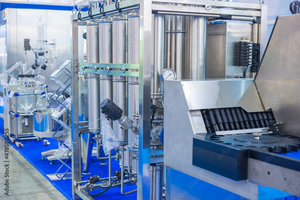 Pharmaceutical automatic production equipment at modern pharmacy factory or exhibition. Manufacturing, pharma industry, medicine and automated technology concept