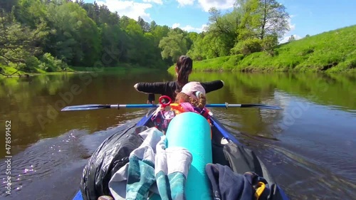 Family kayak trip. Mom and daughter rowing a boat on the river, a water hike, a summer adventure. Eco-friendly and extreme tourism, active and healthy lifestyle photo