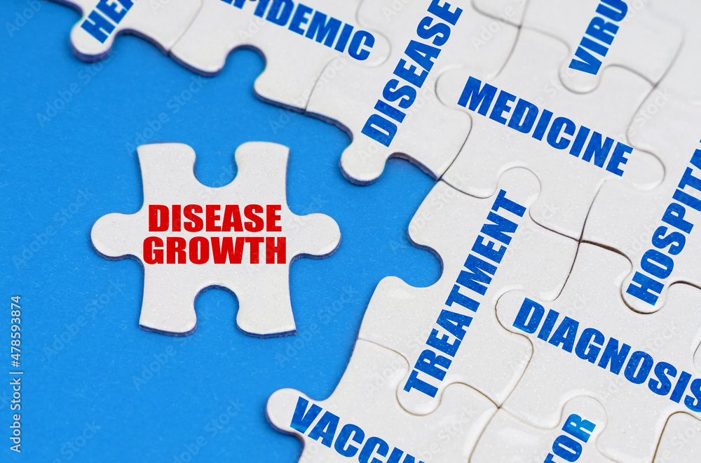 On the blue surface, puzzles with medical inscriptions, on a separate puzzle it is written - disease growth On the blue surface, puzzles with medical inscriptions, on a separate puzzle it is written - disease growth