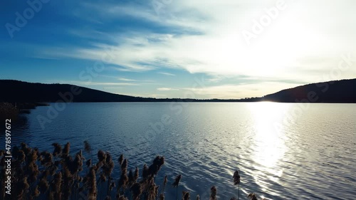 Aerial Drone - Relaxing Landscape at Sunset on Lake Comabbio photo