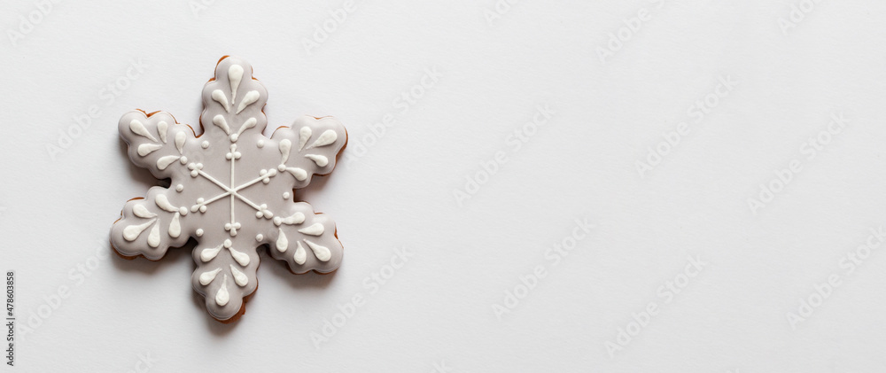 Gingerbread cookie in snowflake shape isolated on white background Gingerbread cookie in snowflake shape isolated on white background