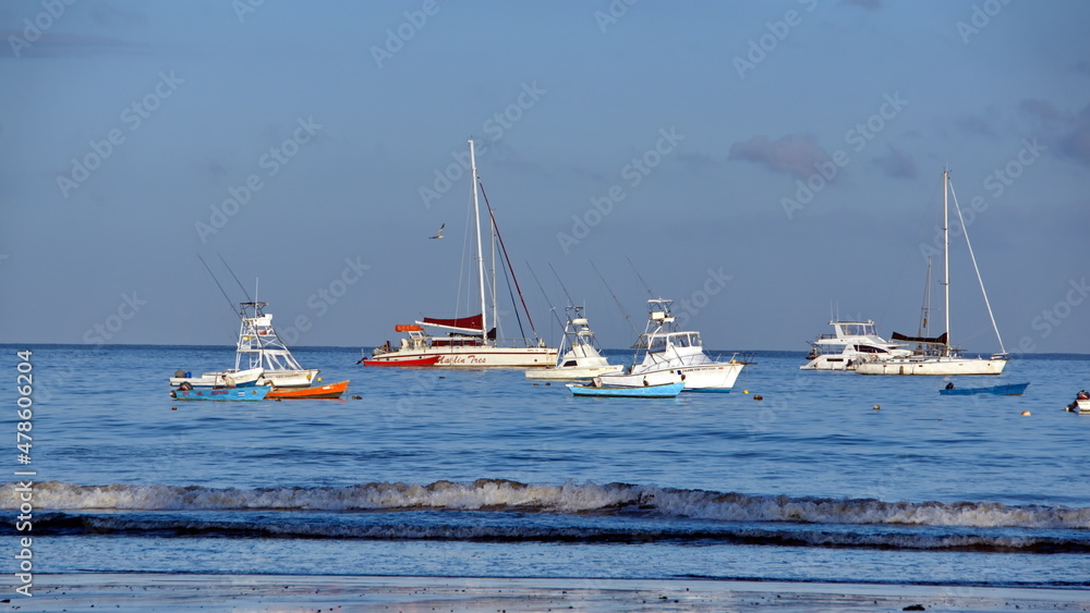 Boats moored off the beach in Tamarindo, Costa Rica, at sunrise