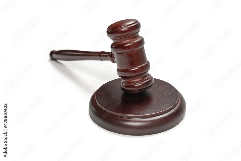 Wooden judge gavel and soundboard isolated on a white background.