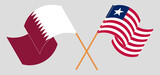 Crossed and waving flags of Qatar and Liberia